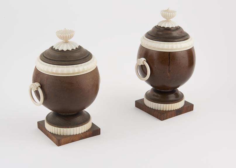 Two ivory and cocoa wood urns, by Holtzapffel and Company