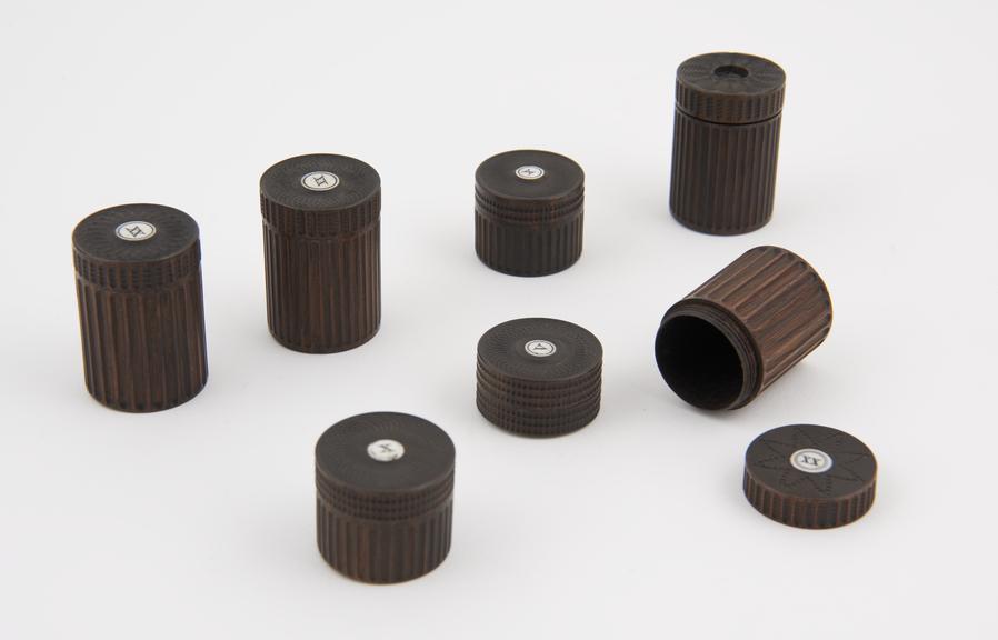 Seven small blackwood boxes marked X-XX-V, ornamentally turned