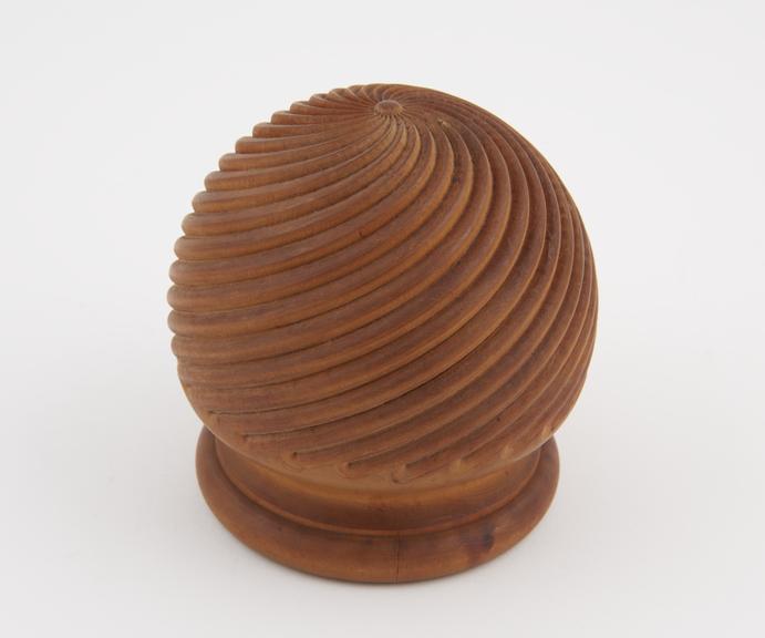 Ornamental wood spheroid with circular base with 24 spiral