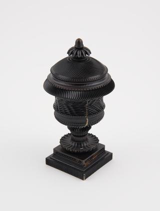 Ebonised ivory vase
