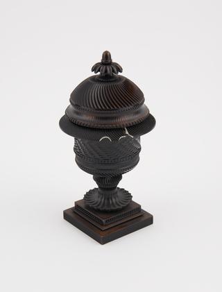 Ebonised ivory vase