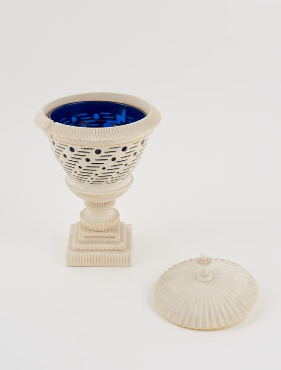 One ivory vase with blue glass lining