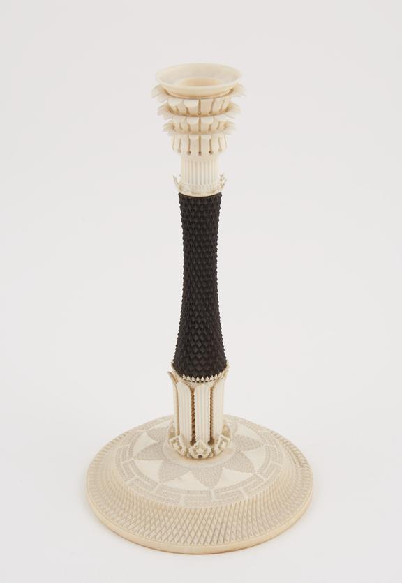 One ivory and blackwood candlestick, by Holtzapffel and Company