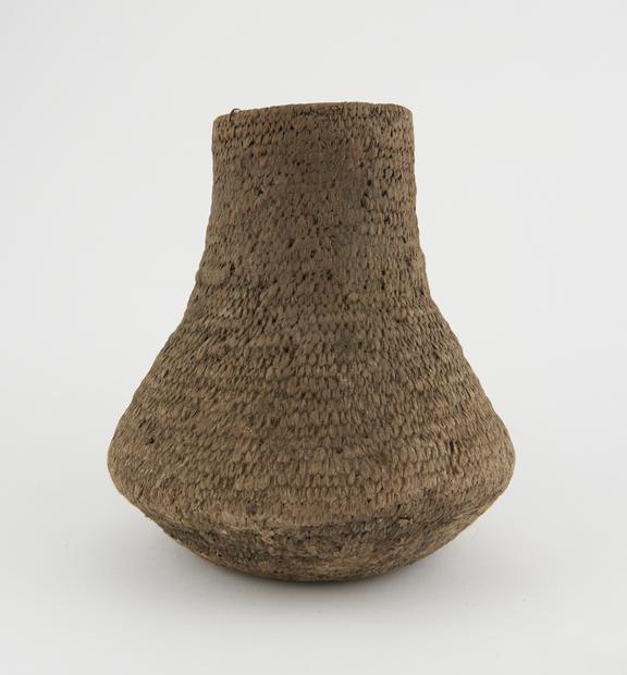 Plaited cane container, vase-shaped, from Turkish Drug shop