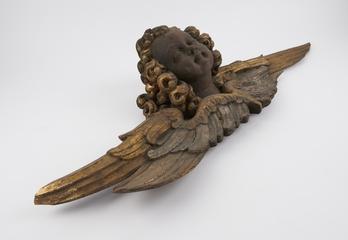 Wooden angel face from an apothecary shop sign