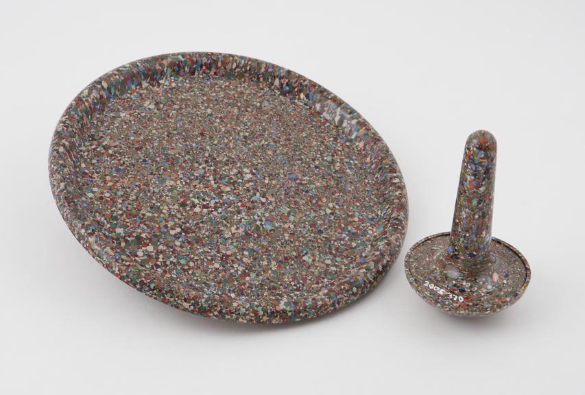 Greyish, multi coloured, pestle and mortar