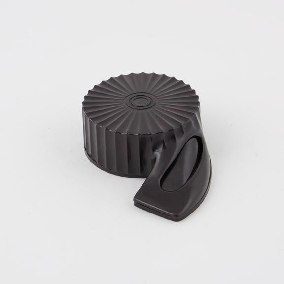 Circular shell-like object made of phenol formaldehyde