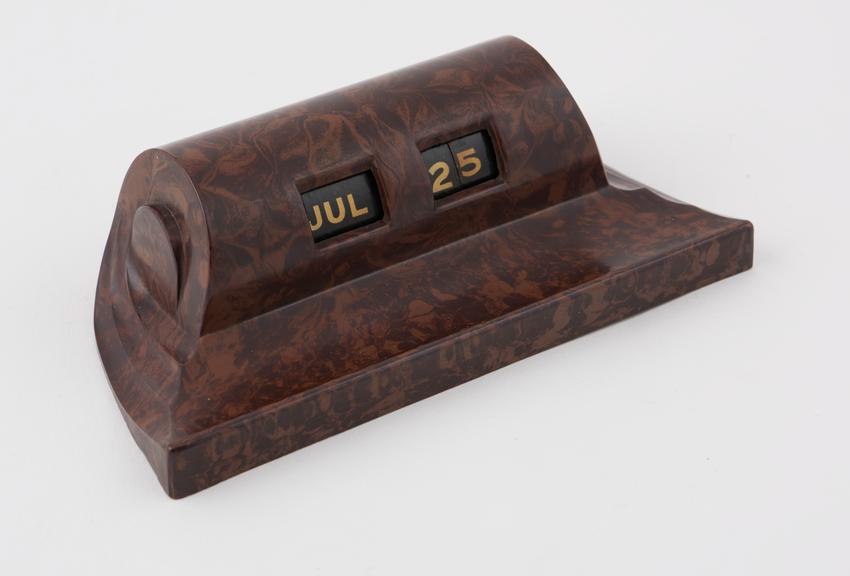 Mottled brown desk calendar made of phenol formaldehyde