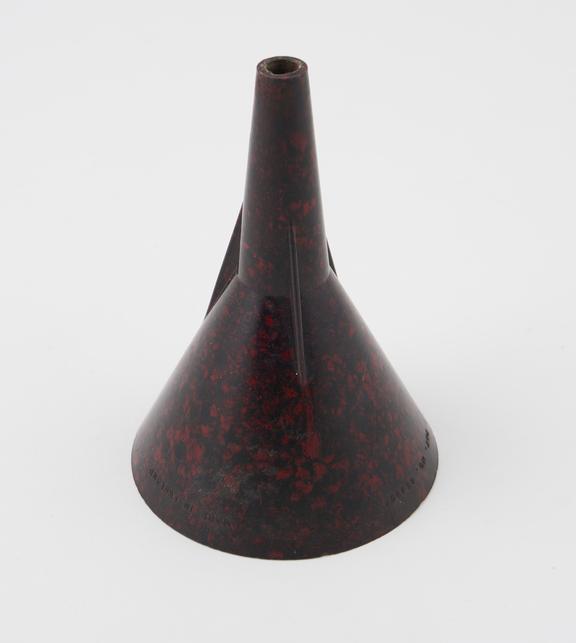 Dark-reddish mottled drinks funnel made of phenol formaldehyde