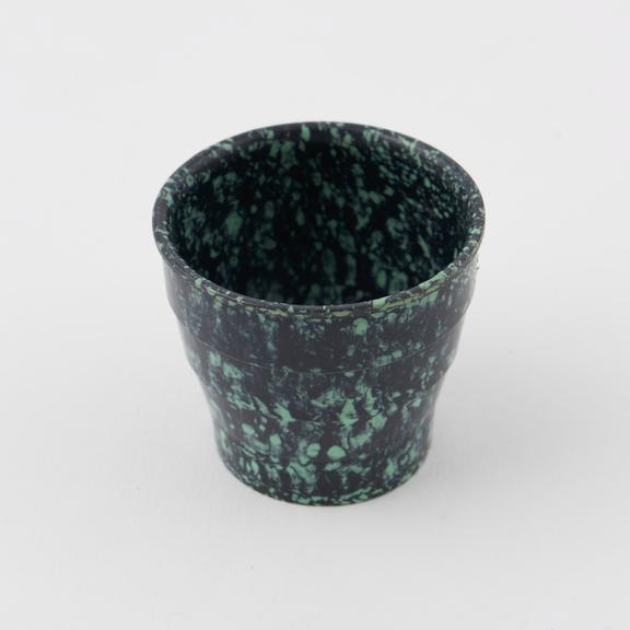 Egg cup made of mottled green/black urea formaldehyde