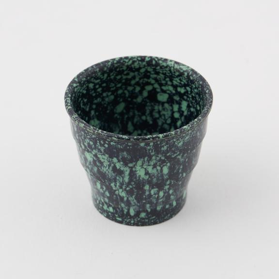 Egg cup made of mottled green/black urea formaldehyde