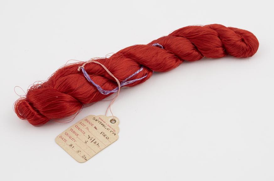 Deep red viscose skein, plaited. Labelled FORM NO. L..5092-7/32