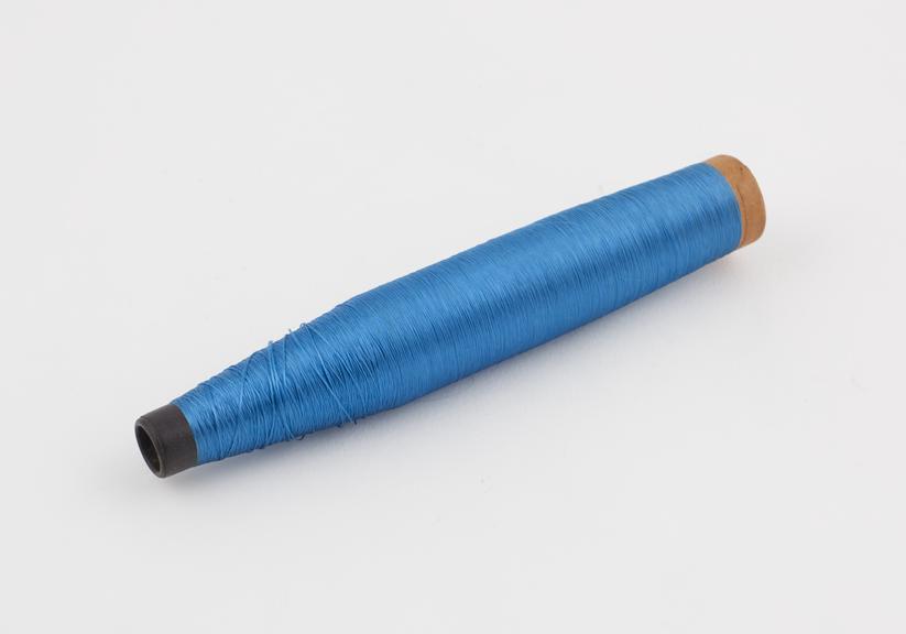 Blue spool of viscose