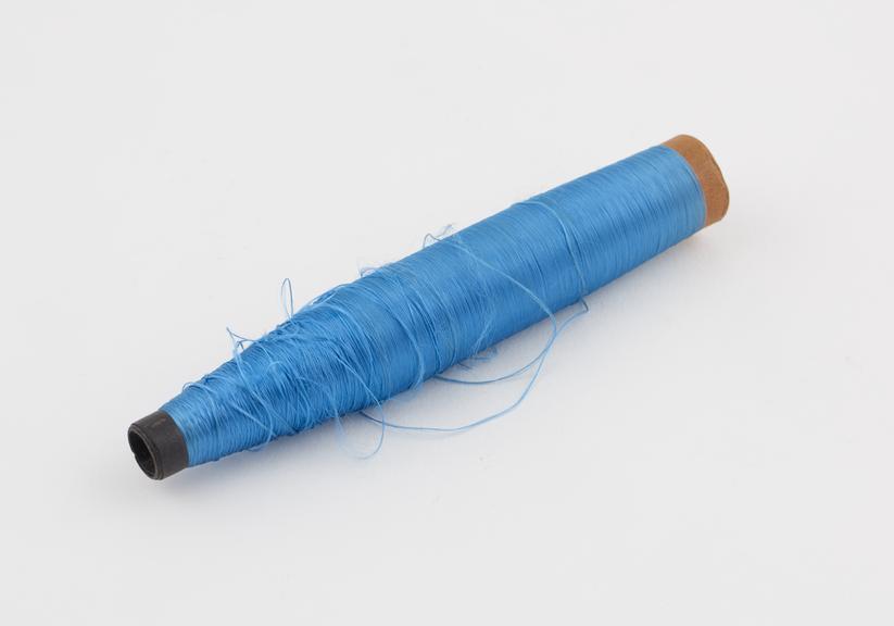 Blue spool of viscose