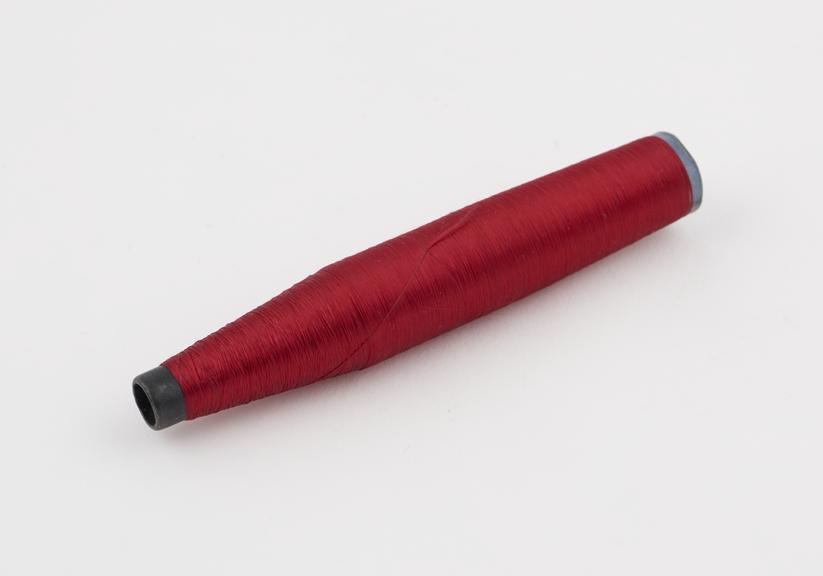 Red spool of viscose