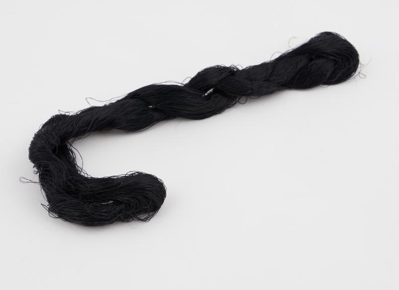 Black viscose skein with associated label Mr Heaven