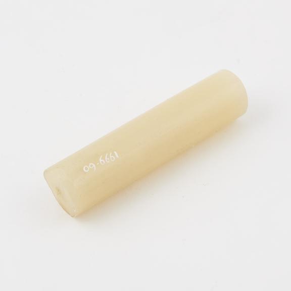 Tube, made of polythene (polyethene), cream in colour