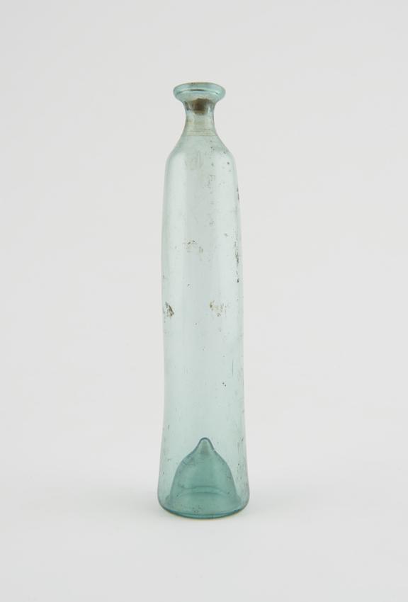 Green glass bottle, long elongated cylinder shape