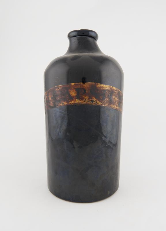 Round storage bottle, dark green glass, empty