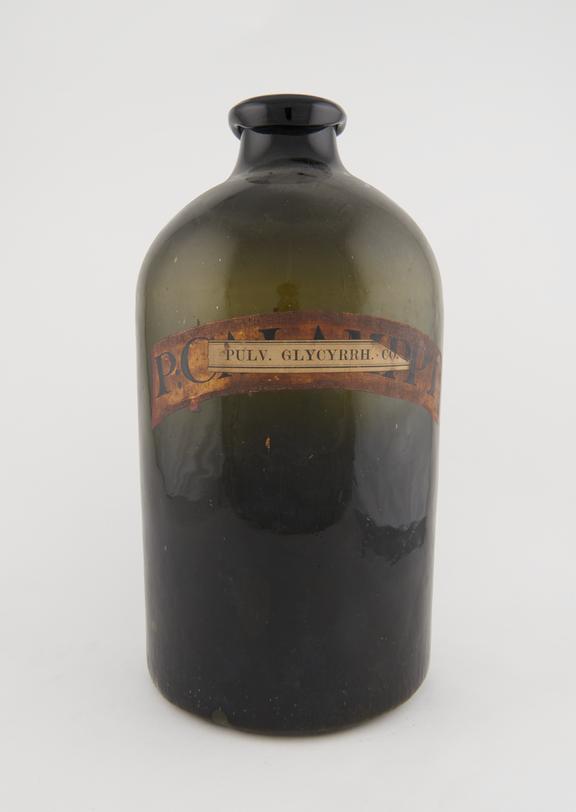 Round storage bottle, dark green glass, empty