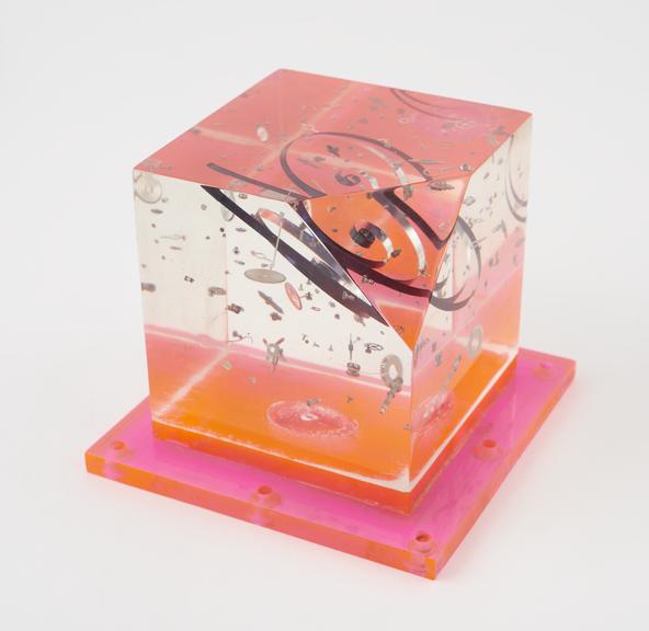 Steel watch parts embedded in perspex