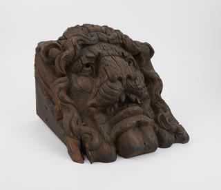 Carved wooden lion face