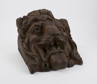 Carved wooden lion face