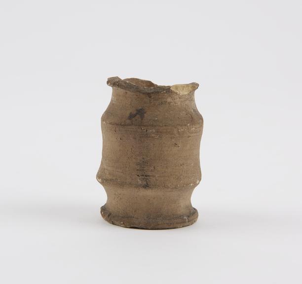 Earthenware dispensing pot, unglazed, albarello shape, 1600-1640