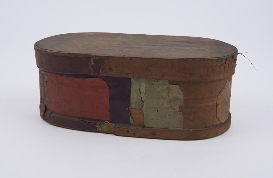 Wooden herb box, half covered in coloured paper