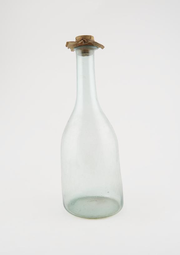 Delicate cylindrical pharmacy bottle, clear glass