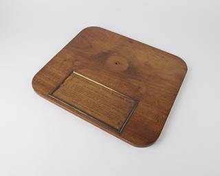 Base and plaque for globe illustrative of the earths magnetism