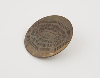 Brass specimen with machined pattern