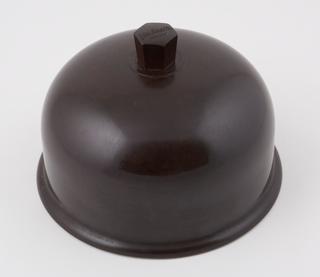 Dome shaped serving dish for hot food, made of phenol formaldehyde