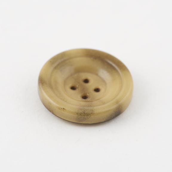 Circular cellulose nitrate covered steel button