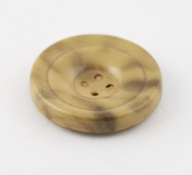 Circular cellulose nitrate covered steel button