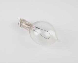 One of eighty-six early incandescent lamps.  Arched filament