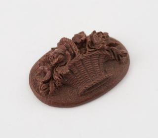 Hand carved medallion of brown Parkesine