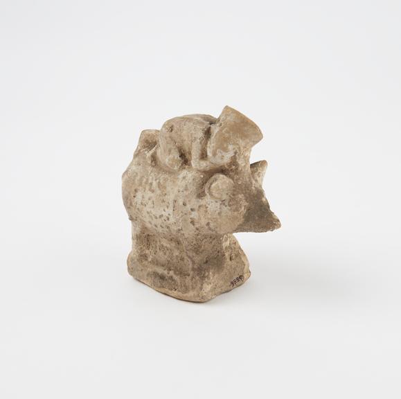 Small figure of child on pig, probably a child's rattle, Roman