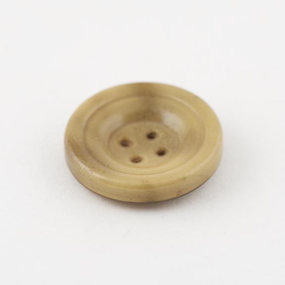 Circular cellulose nitrate covered steel button