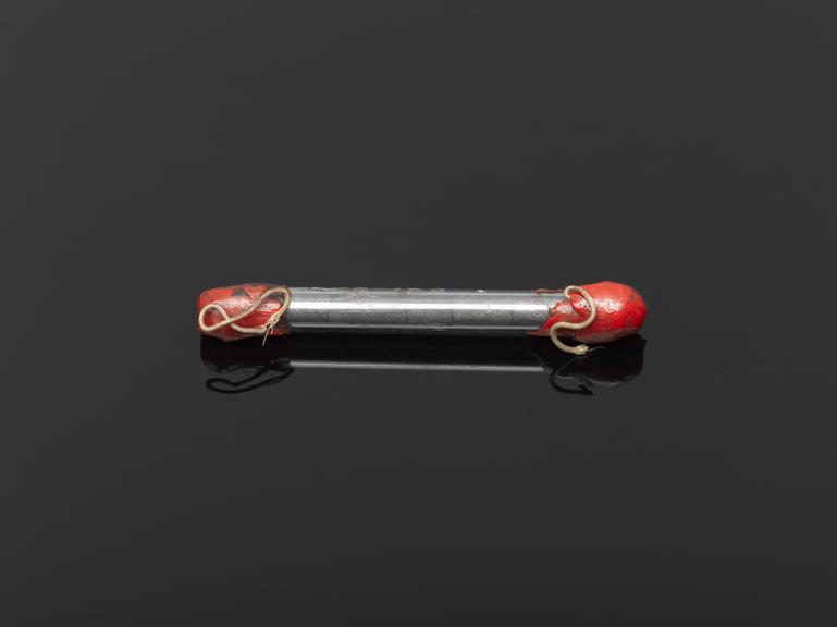 Experimental microphone having two carbon blocks contained in a