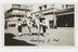 Silver gelatin photograph showing four people (two on horses)