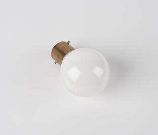 Electric lamp, round white bulb with a brass bayonette attachement