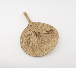 Woven palm leaf fan