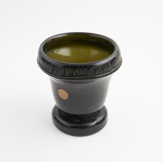 Green glass bell-shaped mortar