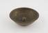 Shallow brass bowl with truncated concical protuberance in base