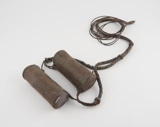 Two leather amulet cases joined by multi-strand twisted leather girdle