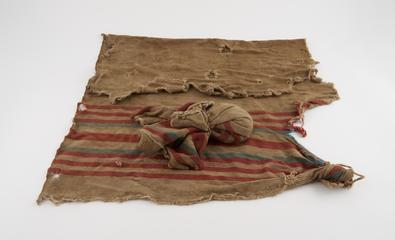 Cloth bag or bundle containing grass(?) wrapped in
