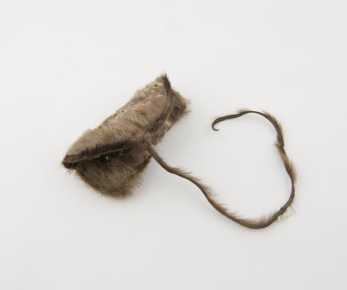 Sealskin tobacco pouch, containing tobacco, beaded decoration