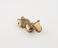 Gold pendant, in the form of a crouching quadruped, hollow