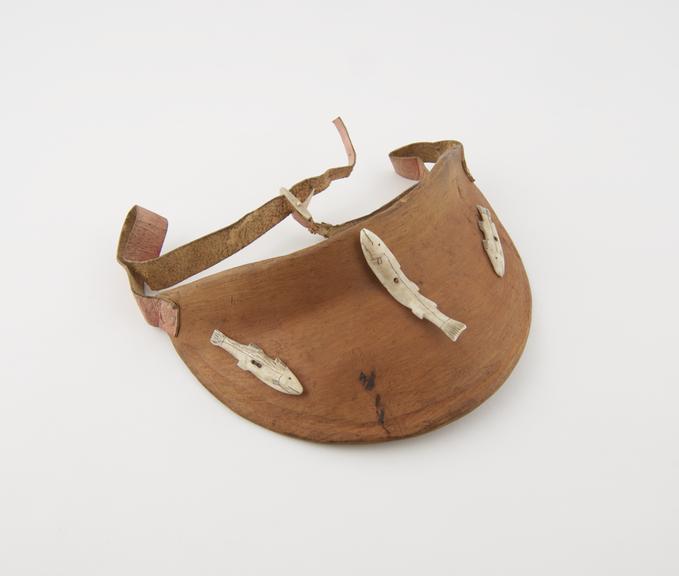 Wooden eye shade, decorated with 3 bone fish, Eskimo